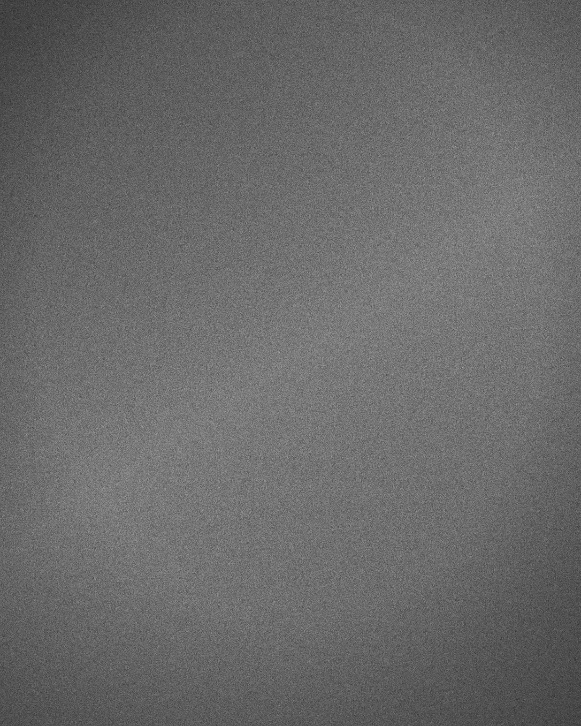Bóxer gris claro de punto fino de algodón, fotografiado de frente sobre fondo neutro